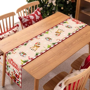 Christmas table runner with reindeer and Santa Claus on a festive wooden table setup