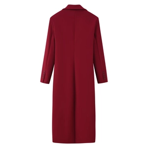 Detail view of the back of a deep red long wool coat with button-decorated sleeve cuffs