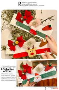 Close-up of Christmas hair clip set with red velvet bow and reindeer plush design