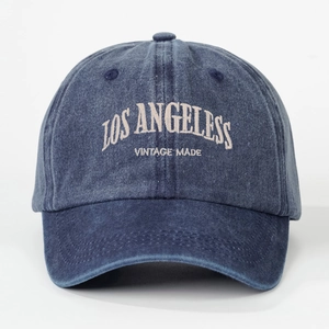 Detailed view of Los Angeles vintage embroidery on navy blue washed cotton baseball cap