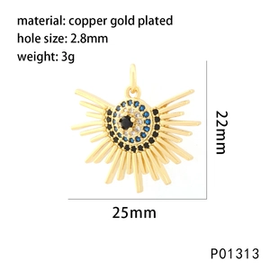 Detail of copper gold plated pendant with sunburst and evil eye zircon setting