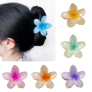 Colorful plumeria flower hair claws in six vibrant gradient shades for women and girls