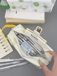 Close-up of yellow floral pencil case with large capacity and portable handle strap