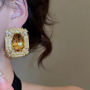 French vintage baroque style golden earrings with amber stones and white crystals