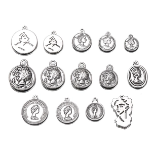 Set of 13 antique silver alloy coin pendants with embossed portraits for DIY jewelry