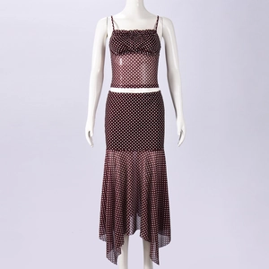 Detail of brown polka dot mesh set featuring a camisole top and fishtail skirt