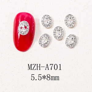 Macro detail of silver dollar sign nail charms with crystals, size 5.5x8mm, for nail art