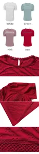 Close-up of delicate hollow-out embroidery and lace details on a crew neck T-shirt