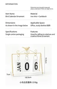 Detailed view of golden iron bird flip calendar with 18.5x7x16.5cm dimensions
