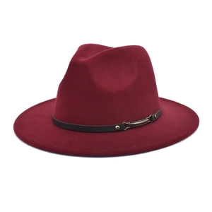 Close-up of burgundy fedora hat wool felt texture and black leather belt with buckle