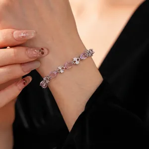French vintage style bracelet with pink zircon gems and clover clusters on wrist