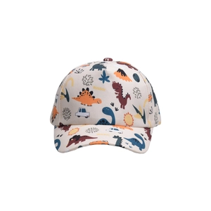 Detail of cream kids baseball cap featuring colorful dinosaur and volcano cartoon prints