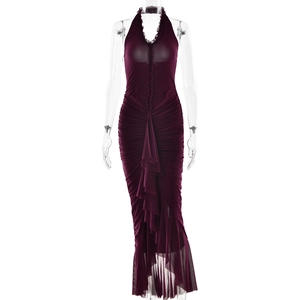 Detailed view of dark purple halter neck dress featuring elegant ruffles and ruched fabric