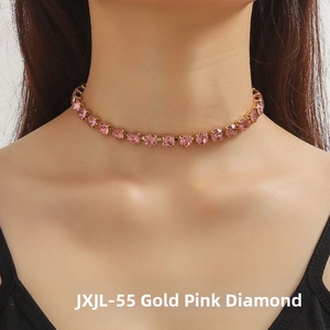 Detail of gold choker necklace with pink square zirconia stones on female neck