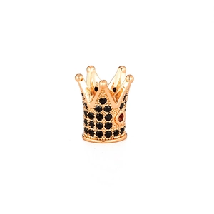 Macro shot of gold crown charm bead with micro-pave black zircon stones for DIY jewelry