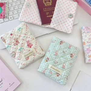 Quilted cotton passport cover with cute cartoon animals and soft fabric texture