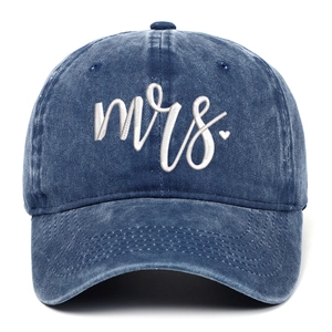 Close-up of blue washed cotton baseball cap with white Mrs. and heart embroidery