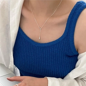 Minimalist 925 sterling silver Y-shaped drop necklace worn by a fashion model