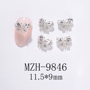 Detailed macro view of 11.5x9mm hollow metal butterfly nail art charms with crystals
