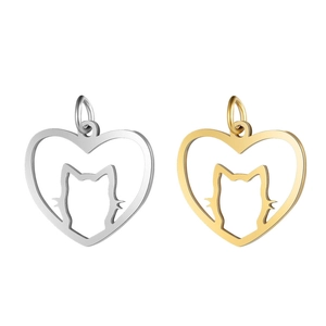 Macro shot of silver and gold heart-shaped metal pendants featuring a cat silhouette