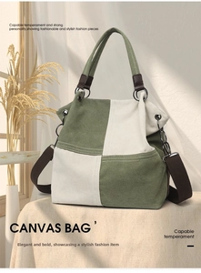Detailed view of bicolor canvas tote bag with brown straps and metal hardware attachments