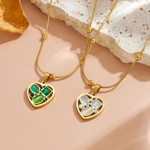 Gold-plated heart pendant necklaces with green cat-eye stone and sparkling zircons