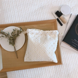 Detailed embroidery on white lace cotton drawstring pouch for cosmetics and small items