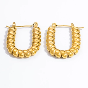 Close-up of golden U-shaped twisted hoop earrings with a polished 18k gold plating finish