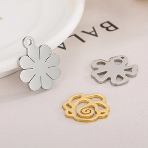 Three minimalist stainless steel flower charms including hollow rose and solid petal designs