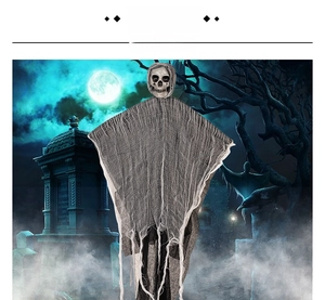 Close-up of Halloween hanging ghost with skull head and tattered grey gauze robe detail