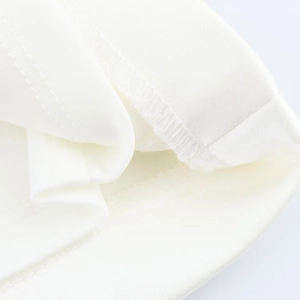 Detailed close-up of white satin fabric showing fine texture and double stitching seams