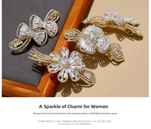Detail of four-piece gold hair clip set with white butterfly crystals and sparkling zircons