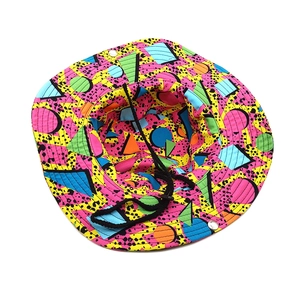 Close-up of retro geometric print on sun hat with adjustable chin strap and metal snaps
