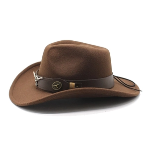 Brown western cowboy felt hat with wide brim and decorative metal bull head emblem
