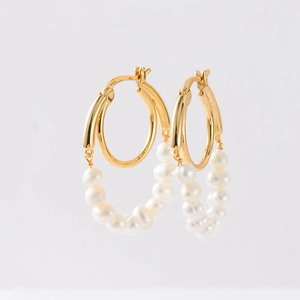 Elegant gold hoop earrings with white pearls in a Bohemian vintage style for women
