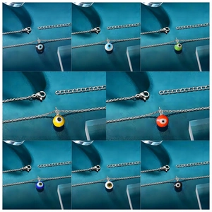 Detail showing eight colors of evil eye pendant necklaces with lobster clasp and chain