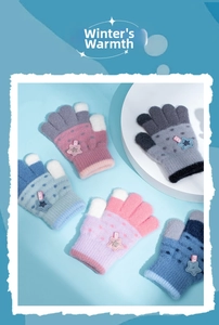 Close-up of colorful knit gloves for kids with star patches and soft plush texture