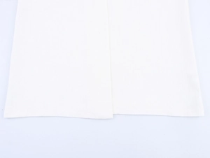 Detailed close-up showing the hem stitching and texture of the white linen windbreaker