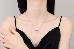 Detail of s925 silver heart pendant necklace with shimmering white moissanite stones