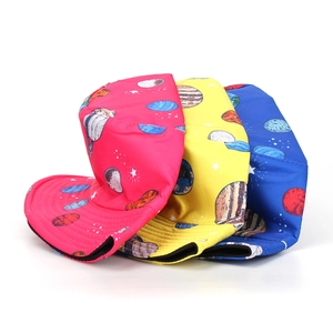 Three sun bucket hats with space planet prints in pink, yellow and blue colors