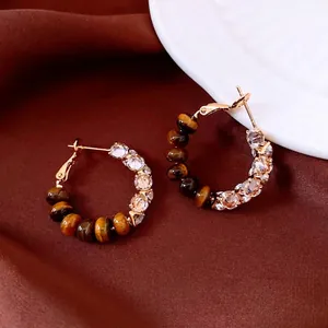 Vintage gold hoop earrings with brown tiger eye stones and cubic zirconia accents
