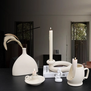 Minimalist cream ceramic decorative set including vases and candle holders for home decor