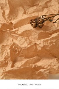 Detailed macro shot of thick brown kraft wrapping paper with natural crinkle texture