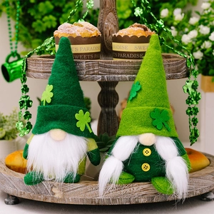 Detail of fabric St. Patrick's Day gnomes with green clover hats on a wooden tray