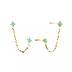 Detail of gold chain earrings with turquoise studs and elegant link fringe jewelry
