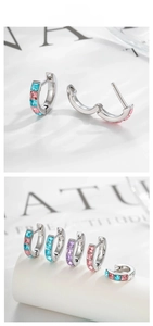 Detailed view of copper earrings with colorful zircon stones and secure clasp closure