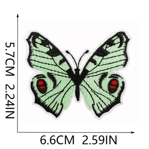 Detail of green butterfly embroidered patch with dimensions 6.6x5.7cm on white background