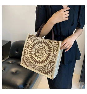 Detail of large linen tote bag with brown geometric circles and sturdy handles