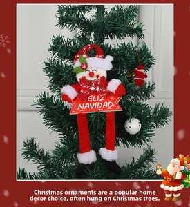 Christmas snowman hanging ornament with Feliz Navidad sign on a green Xmas tree branch