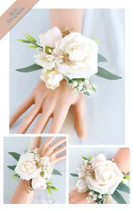 Detail view of light champagne silk rose bridal wrist corsage with golden leaves